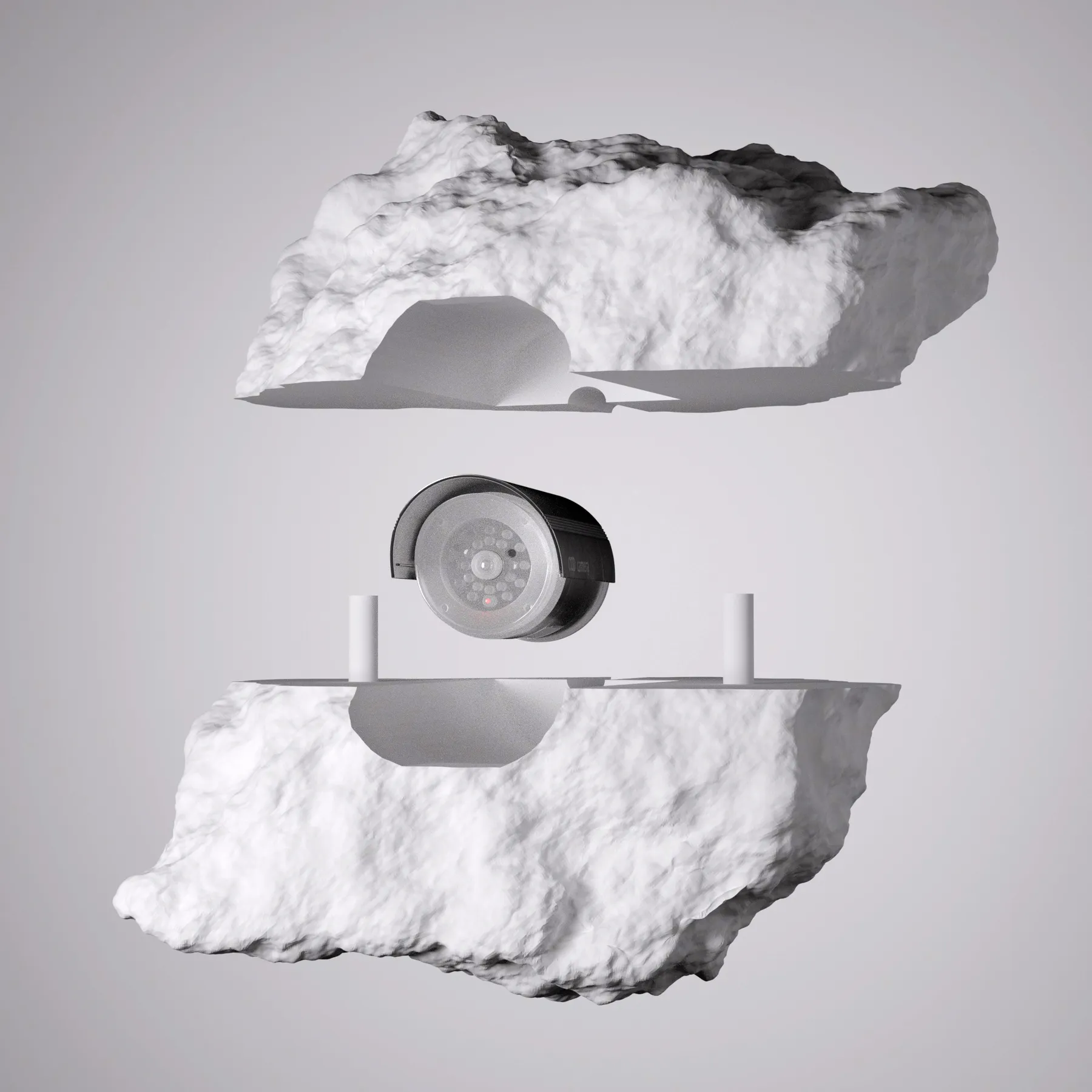White 3D rock form shown with a security camera embedded between two sections.