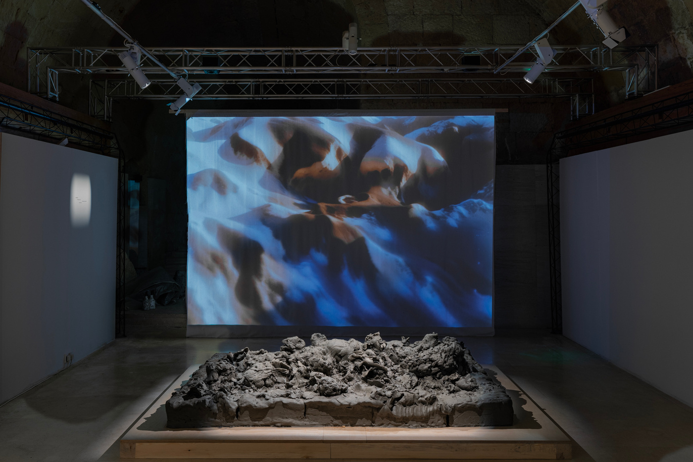 Installation view of dream edges, with projected video and sculptural forms.